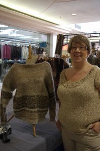 bjg1 Sharon Hudemka, owner of a business called Knitting Time, and organizer of the Lethbridge team in the International Wool Challenge, poses with last year's completed sweater.