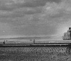 Nat Leonard of Tessier, Sask., runs his International TD9, Series 91 (likely), pulling 38 feet of McCormick press drills, May 10, 1958. In the May 15 edition of The Western Producer Leonard says he manages to seed about 20 acres an hour, covering about 200 per day.  |  Western Producer Archive image