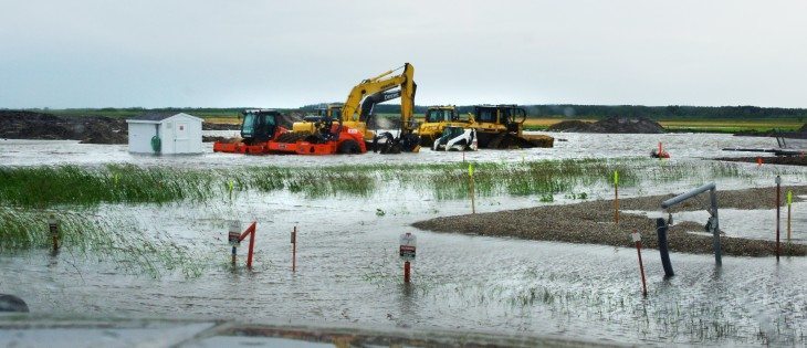 June 29, 2014 north of Souris, Manitoba on Highway 250 after 102 mm of rain fell in 24 hours.Enbridge pipeline equipment buried in the heavy rainfall. | Diane Winters photo