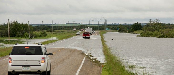 Water floods Highway 80 just north of Esterhazy, Sask.  |  Robin Booker photo