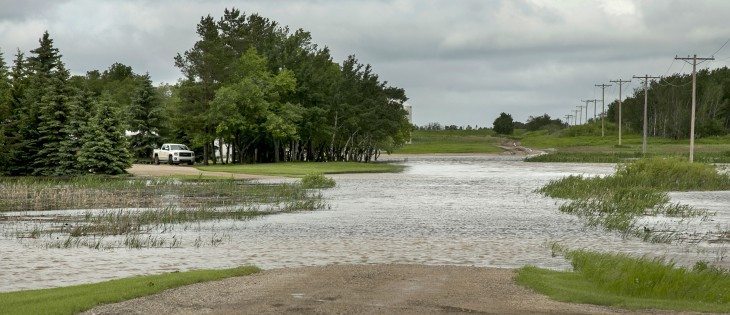 Heavy rain flooded a farm lane, west of Melville, Sask., on Highway 15.  |  Robin Booker photo