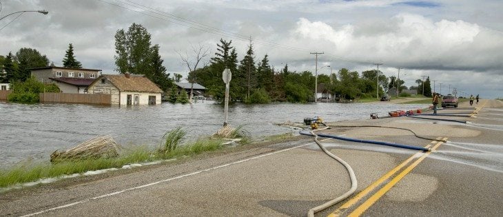 Residents of Fenwood try to pump out the town. Laurie Stopa, a resident of the town said a neighbour woke him up at 4 a.m. on June 30. He said the water was juststarting to run into the town, and within two hours his house was flooded. | Robin Booker photo