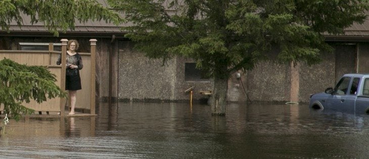 Residents of Fenwood try to pump out the town. Norah Stopa, a resident ofthe town said a neighbour woke she and husband Laurie up at 4 am on June 31. He said the water was juststarting to run into the town, and within two hours his house was flooded. | Robin Booker photo