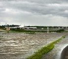 Flood water flows over a grid road on the south side of Highway 16, 3 Km. west of Foam Lake, Sask. | Robin Booker photo