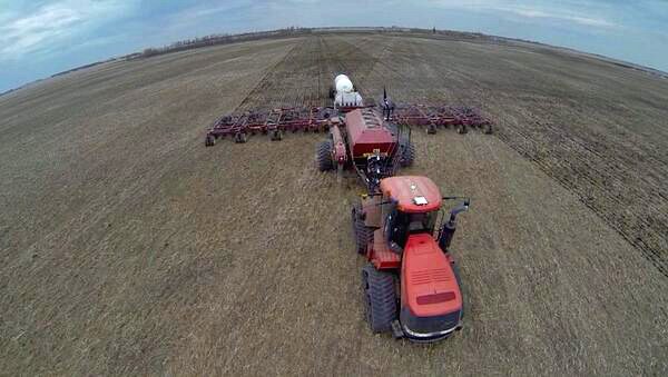 Emery Grismer @eagrismer Seeding wheat with a little Alpine from Nachurs Alpine Solutions. #hawksighting #plant14 @The Western Producer