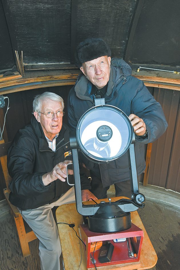 Garry Stone, left, and Tenho Tuomi ready the 200 millimetre telescope for an evening of star gazing in Stone’s home built observatory on his farm near Strongfield, Sask. | William DeKay photos