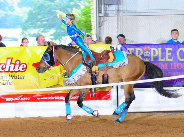 Piper has learned to perfect technically difficult moves such as the hippodrome, where she has to lean far forward in the stirrups so her hips touch the horse's ears.| Photo courtesy Kelsey Yule