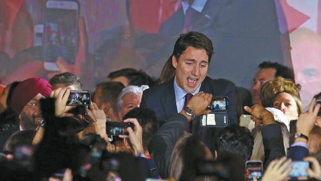 Liberal Party leader Justin Trudeau is greeted by supporters as he arrives to give his victory speech after Canada's federal election in Montreal, Quebec, October 19, 2015. | REUTERS photo
