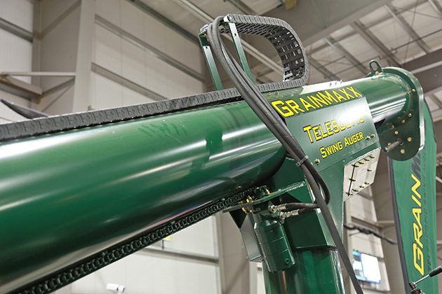 The telescopic movement is powered by a hydraulic motor, which has a sprocket that moves a chain running alone the swing section of the auger. | Robin Booker photo