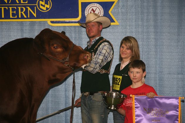 Rodney and Tanya Hollman and their son, Wacey, won the grand champion bull award for their Gelbvieh bull named Right Combination at the 2017 National Western Stock Show in Denver, Colorado. Owners of Royal Western Gelbvieh, the family regularly attends the international event but this is their first grand championship. | Barbara Duckworth photo