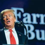 U.S. president Donald Trump speaks at a podium.