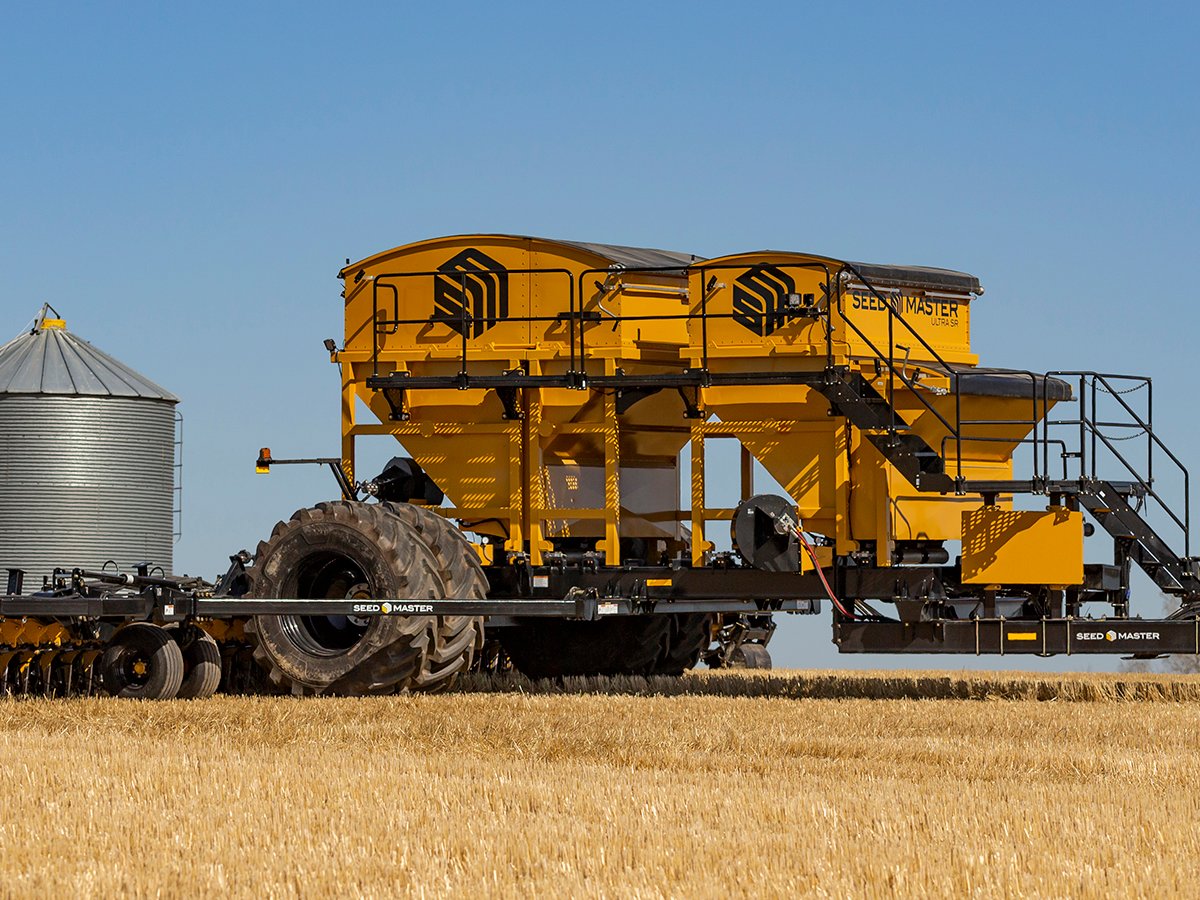 A SeedMaster air drill at work in a field.