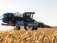 A New Holland front-boom sprayer in action.