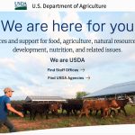 Screencap of the homepage of the USDA with an image of a farmer walking through a pen with cattle in it.