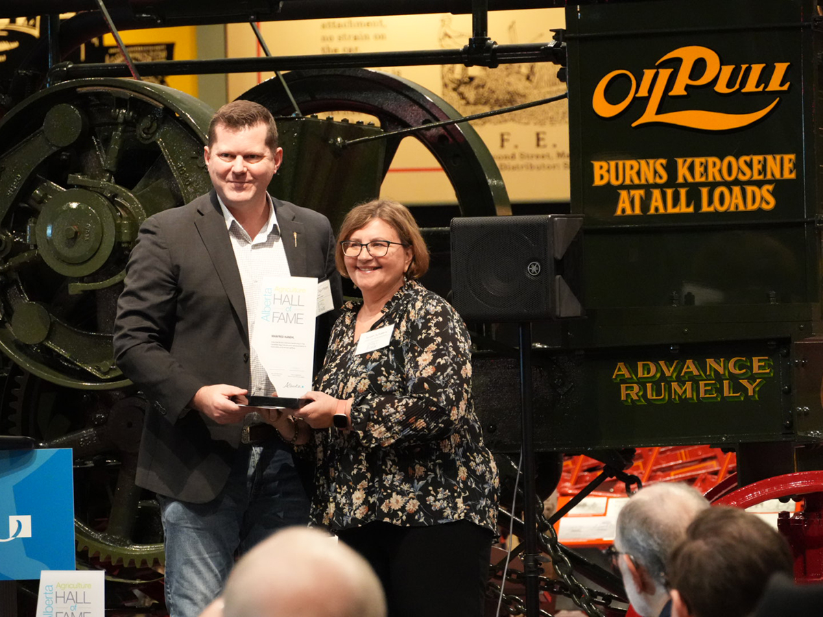 Manfred Kanehl, a contributor to advancements in animal welfare and food safety within the Canadian egg industry, was inducted into the hall of fame posthumously. His daughter, Susan Schafers, accepted the award from Alberta agriculture minister RJ Sigurdson. | Supplied photo