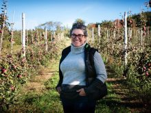 Stephanie Levasseur, an apple grower from southern Quebec stands in her orchard.