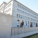 A photo of the sign of the World Trade Organization on the building itself in Geneva.