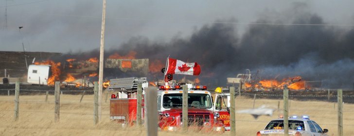 A trailer and other structures in a yard burn after high winds sent a grassfire-turned-wildfire on a destructive path across the prairies east of Nanton, Alta. | Mike Sturk photo