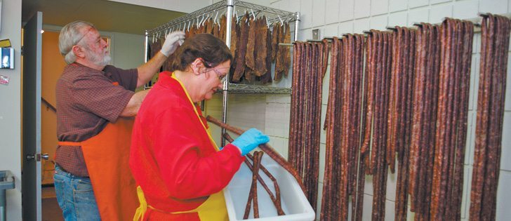 Rod and Mal Paterson of Cranbrook, B.C., hang the South African-style dried meat and sausage they package and sell online and at farmers’ markets. Mal uses Canadian mustard in her flavoured Majestic Mustard products.  |  Karen Morrison photo