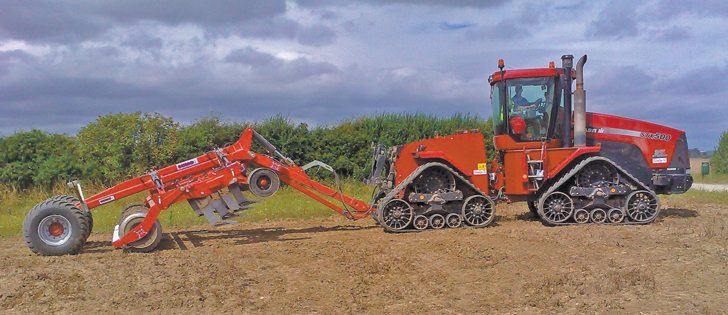 In the raised position, the Sumo subsoiler is carried by the hitch and two large flotation tires. |  Neil Patterson Photo