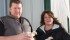 Mark and Diane Pastoor with two young broiler chickens outside the barn at Chicks R Us Poultry near Dalmeny, Sask. | Karen Briere photo