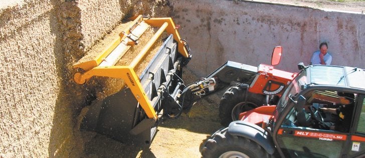 At first glance, the silage pile looks like a stack of big square bales. Upon closer examination, we see that the smooth hard packed front surface is the clean shaven face left by the rotary defacer.  |  Kara Burell photo
