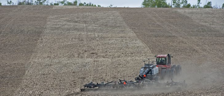 Isidore Boutin Jr., of Bellevue, Sask., seeds canola May 17/12. William DeKay photo