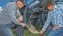 Gavin, left, and Colin Greenwald look at an opener on their air drill during a field day held on their farm June 12. | William DeKay photo