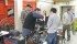 Students with the University of Manitoba Association of Tiny Tractors put the finishing touches on their 31 horsepower pulling machine. | University of Manitoba photo