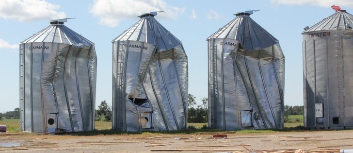 Granaries were caved in by the force of the wind at Siegert Wenning’s farm near Wroxton, Sask. A row of six smaller bins were torn off their foundations and scattered across the field. In all, 120,000 bushels of grain storage were lost. The total dollar value of the farm’s damage is still being assessed.  | Chris Putnam photo
