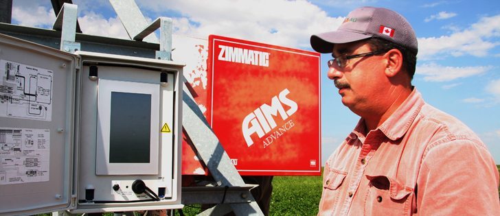 Jeff Bronsch checks an electronic panel at the centre point of an irrigation pivot in one of the Perry’s potato fields. Variable rate irrigation and fertigation are done using prescriptions Bronsch devises using field maps, soil moisture data and information on crop demands.  |  Barb Glen photo