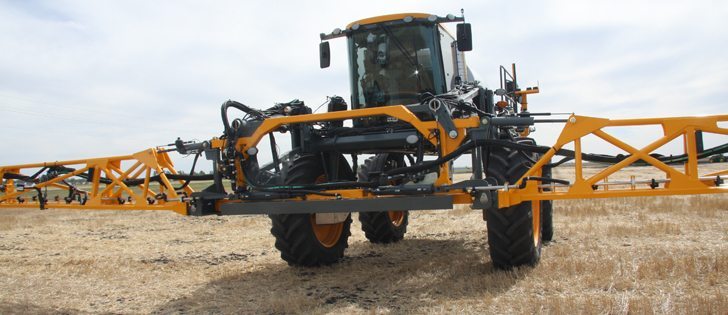 The latest innovation from Hagie is a 132 foot aluminum spray boom fitted to its STS16. The design uses a simple swinging pendulum suspension with two pivot points floating left and right as the boom goes up and down. | Ron Lyseng photo
