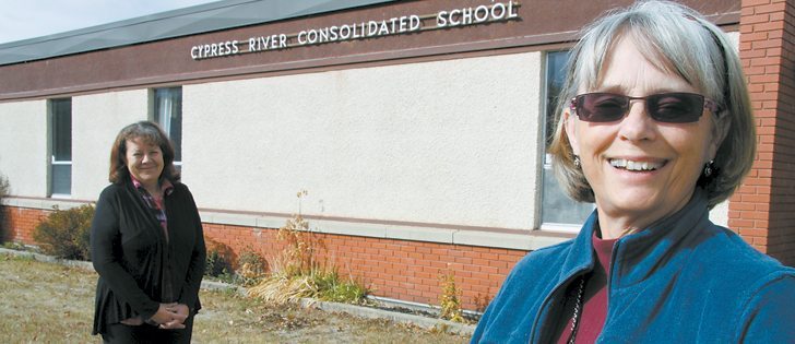 Linda Truelove, right, and Georgette Hutlet are part of a group that purchased the former elementary school in Cypress River, Man., in 2011. Within 12 months, the directors of the Cypress River Resource Centre opened a secondhand store in the school and hosted a music festival. In January, the Assiniboine Community College of Brandon will train nurses in the building.  |  Robert Arnason photo