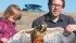 Kamryn Heck, 3, and her father, James Heck, of Calgary prepare to release a hawk Oct. 4 near Lethbridge. It was one of two rescued by Pam Bergen on her farm near Cardston, Alta., after a July hailstorm killed the hawk’s parents. | Barb Glen photo