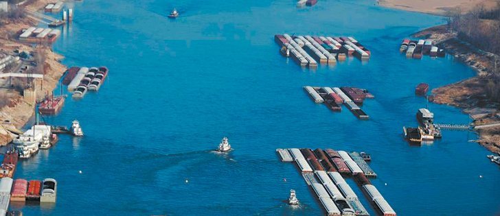 Barge operators are already reducing load weights to avoid running aground in the drought-lowered Mississippi.  |  U.S. Coast Guard photo