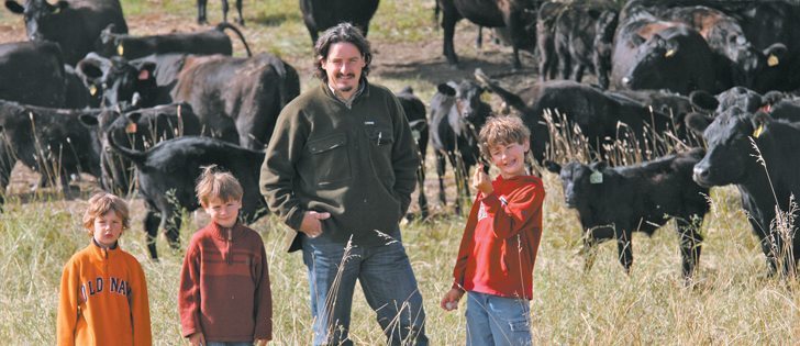 Christoph Weder and three of his children, Pasco, Nero and Oro, with a group of Angus cattle on his ranch at Rycroft, Alta.  |  Mary MacArthur photo