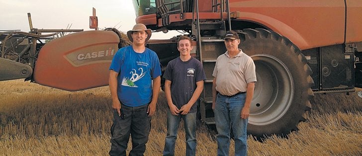Matt Reimer, left, hired hand Toby Whitfield and Matt’s dad, Stan Reimer, brought in the harvest on the Killarney, Man., farm last fall.  |  Reimer family photo