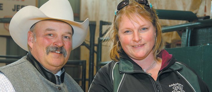 At a bull sale in Neepawa. Man., in late February, Brent Stewart, left, a cattle producer from Russell, Man., donated a Black Angus heifer to Angie Fox of Eddystone, Man. Just before Christmas 2011, Angie’s husband Jay died in an accident on their farm. Since that time, dozens of people in Manitoba’s cattle community have supported Angie and her four children through financial donations and by volunteering their time on the Fox family farm, a 250 head cow-calf operation.  |  Robert Arnason photo