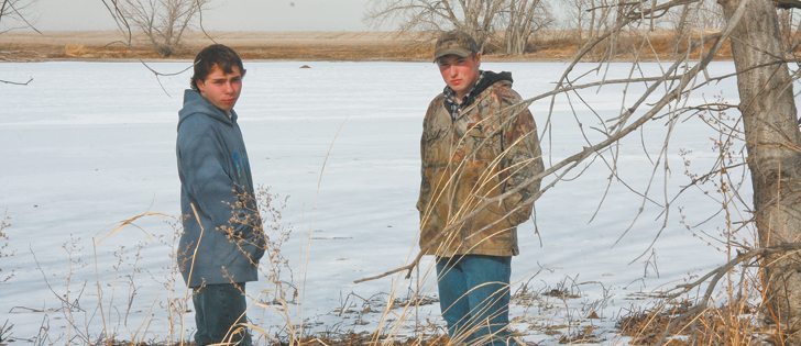 Curtis, left, and Calvin Holthe were hunting on this pond in a neighbour’s field in November 2011. Calvin ventured onto the ice to retrieve a duck he had shot when the ice broke and plunged him into about two metres of water. Curtis fell in while trying to help his brother, but the two managed to escape.  |  Barb Glen photo