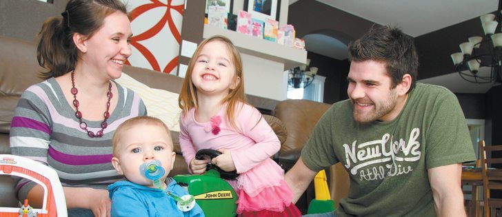 Randy Froese, right, and his wife, Shelley, live in Winkler, Man., with their daughter, Bella, 3, and son, Ryan, eight months. Randy, who farms east of Winkler, decided several years ago to live in town rather than on the farm because he and Shelley want to separate farm life from their home life. |  Robert Arnason photo