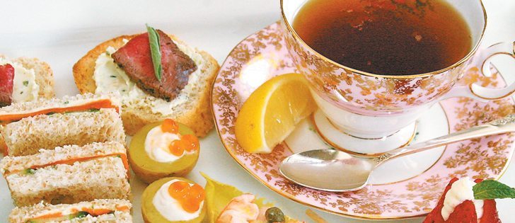 Left, clockwise: Salmon cucumber finger sandwiches, beef tenderloin crostini, tea with lemon, mascarpone filled strawberry,  endive with shrimp salad, shrimp ceviche in cucumber and baby potato with crème fraiche topped with salmon caviar. |  Sarah Galvin photo