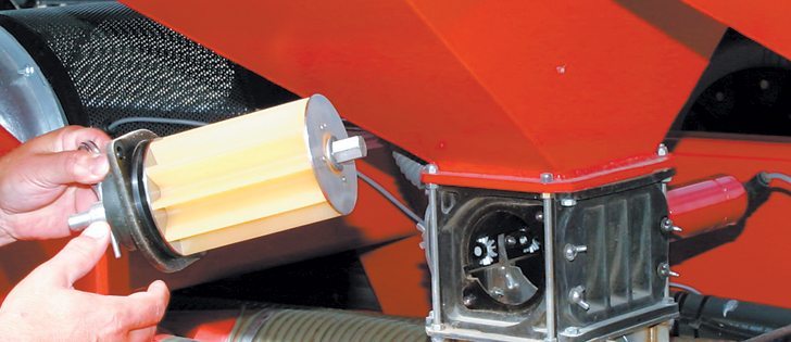 Driven by digitally controlled electric motors, these meters provide more precise metering than hydraulic or mechanical drive units.  The housing attaches to the hopper bottom with four bolts.  |  Ron Lyseng photo