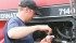 Lane Stockbrugger checks fluid levels on his tractor. | Karen Morrison photo