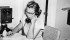 Emmie Oddie tracks down answers to readers’ questions at her farm house at Milestone, Sask. (circa 1950). | Oddie family photo