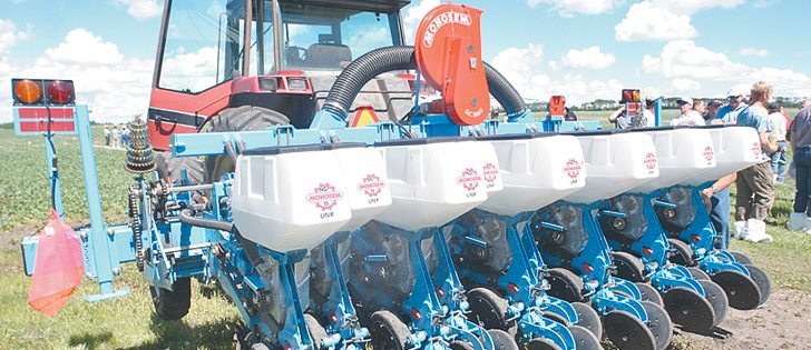A residue manager was placed ahead of the discs to sweep away straw from the rows for more accurate seed placement and less plugging. | Mary MacArthur photo