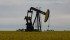 A pump jack in a canola field near Fairview, Alberta.