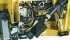The PTO from the combine drives the in-feed auger through a gearbox. Knives and drapers are driven by two separate hydraulic motors. | New Holland photo