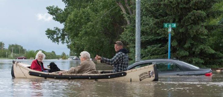 Two woman were rescued from their residences by a canoe in the High River flood. | Mike Sturk photo 