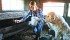 Nicole Rindisbacher is accompanied by Moses as she gathers eggs. | William DeKay photo