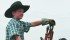 Eleven-year-old Ethan Harty of Strome, Alta., spent his 4-H earnings to buy a steam tractor. He helped operate another tractor during a recent threshing demonstration near Moose Jaw. | Karen Briere photo